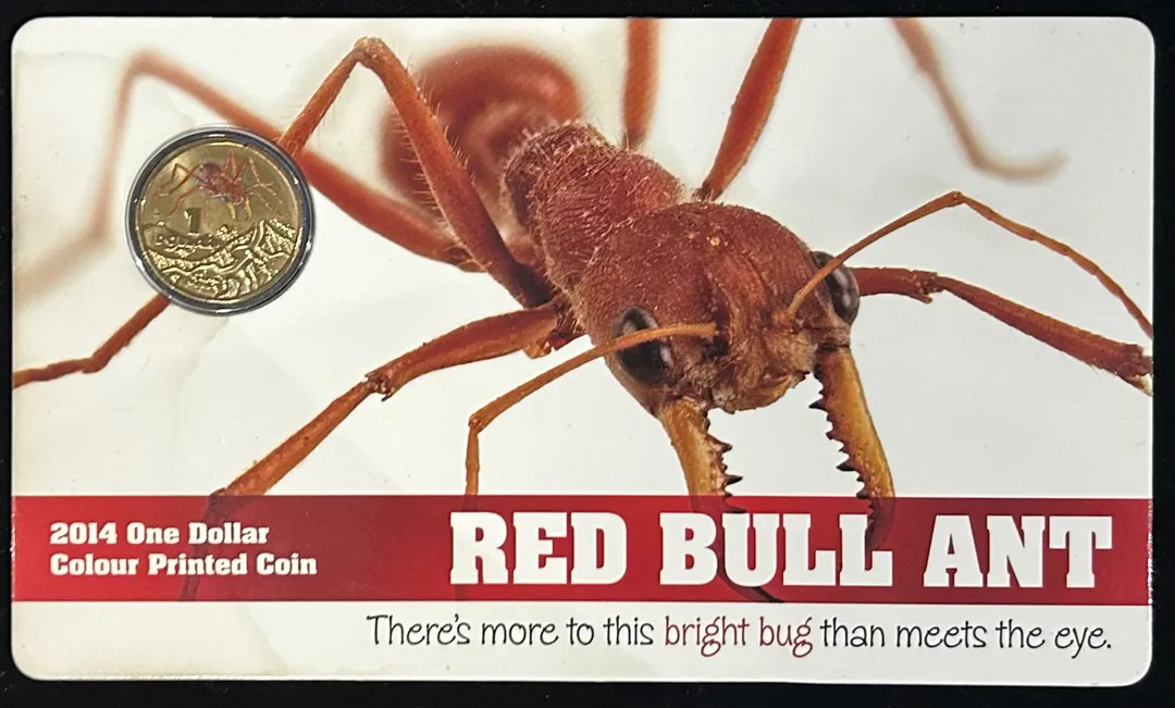 Lot 36 — 2014 $1 Red Bull Ant Coloured Coin (Card Damaged/Stained)